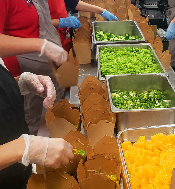 Cooks preparing salads